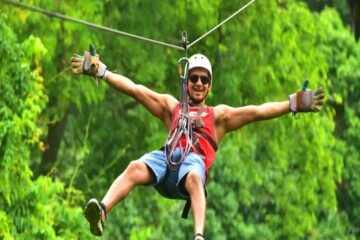 man riding a zipline in jaco costa rica